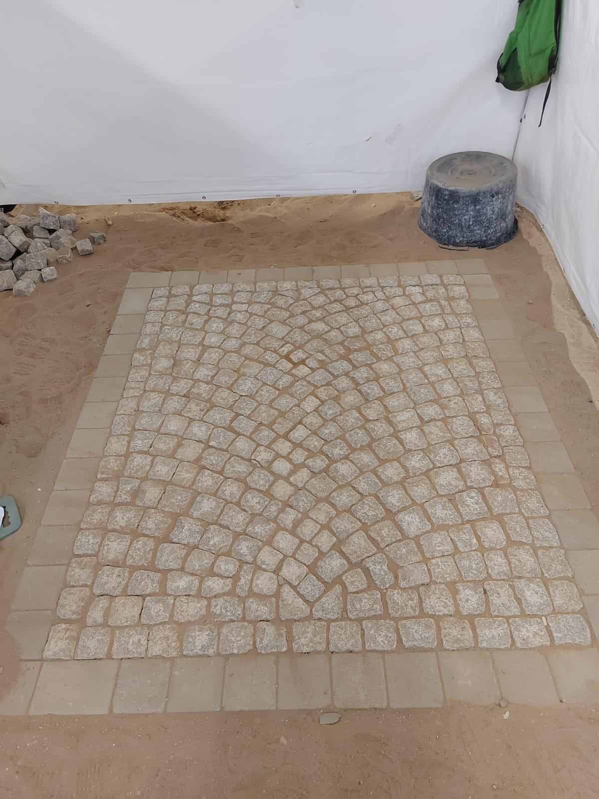Granit-Kleinpflaster im Segmentbogen